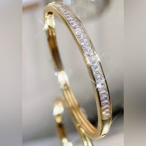 Gold Bangle with Emerald Cut Stones. Classic Elegance